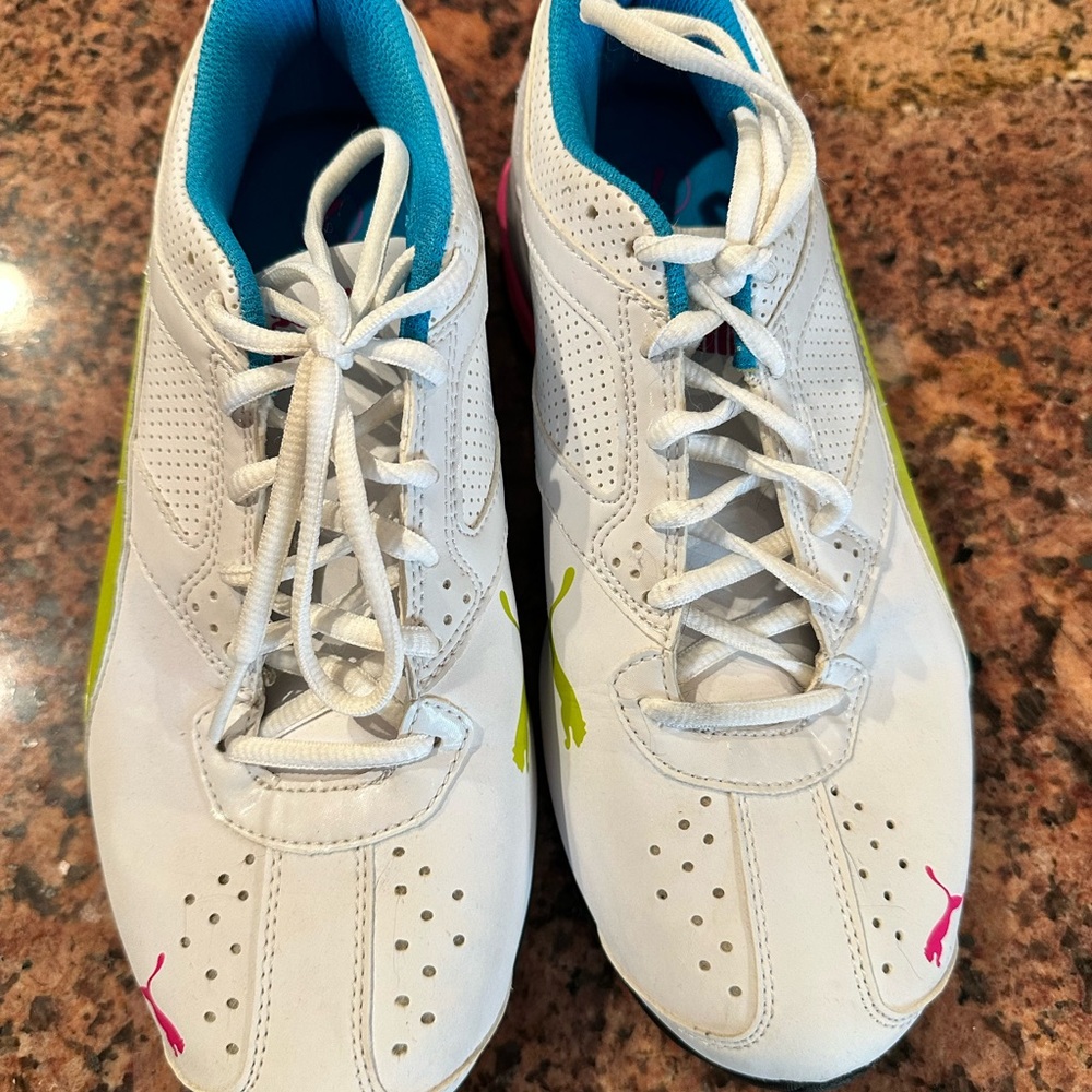 White and Blue Athletic Shoes with Pink Accents